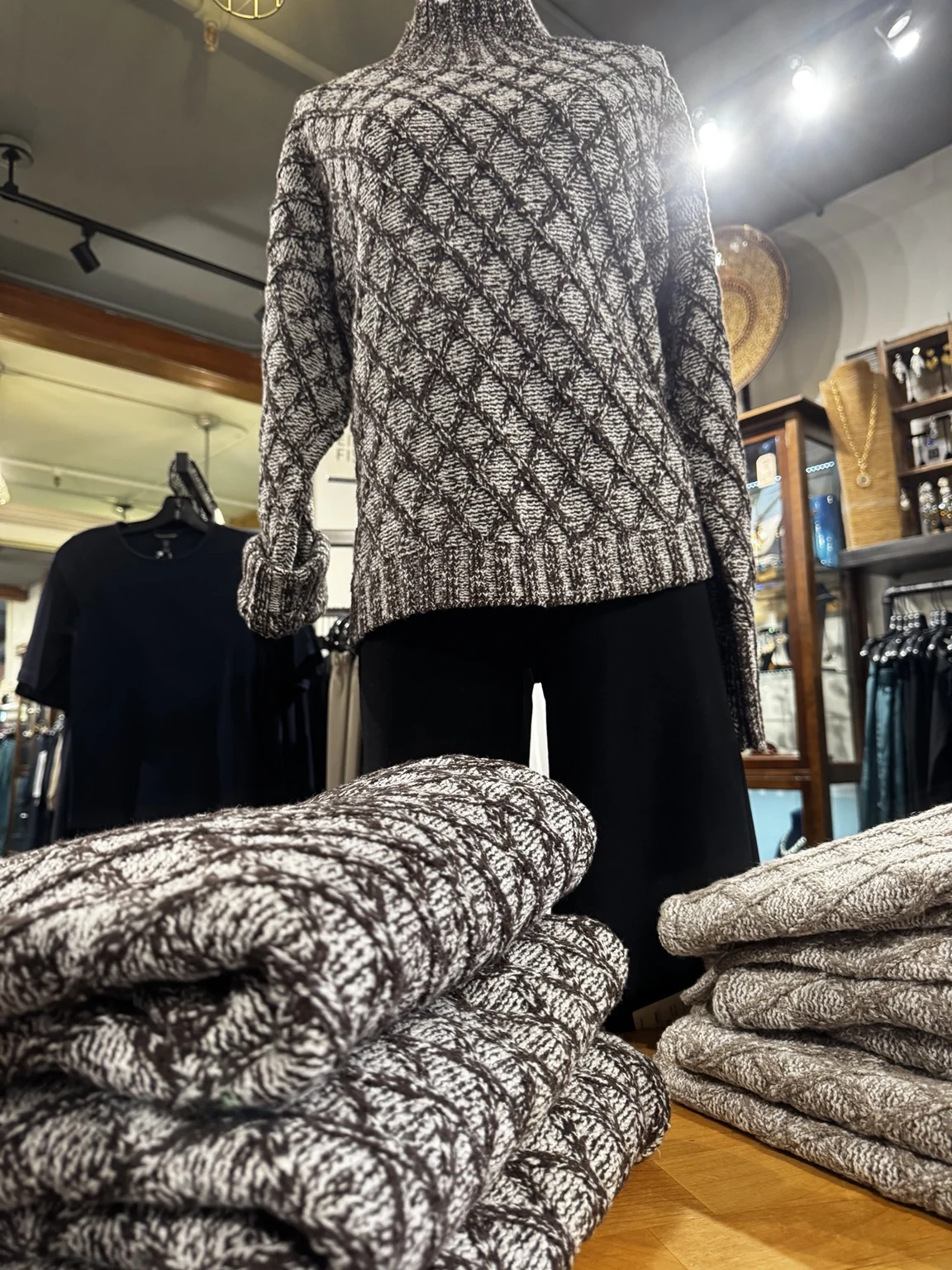 Soft monochrome knitwear styled in the boutique